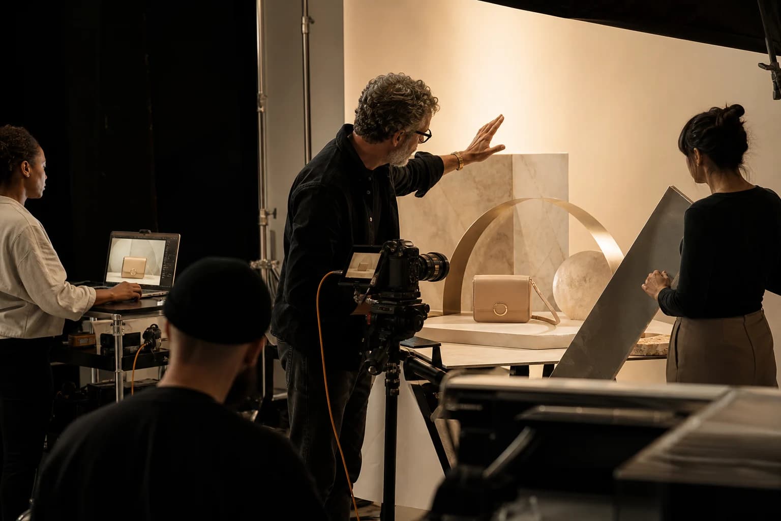 Commercial photography crew directing a product campaign set